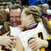 Mark Manders embraces his daughters Jessie and Taylor after the game against Saginaw Nouvel on Saturday, March 16. Daniel Brenner I AnnArbor.com